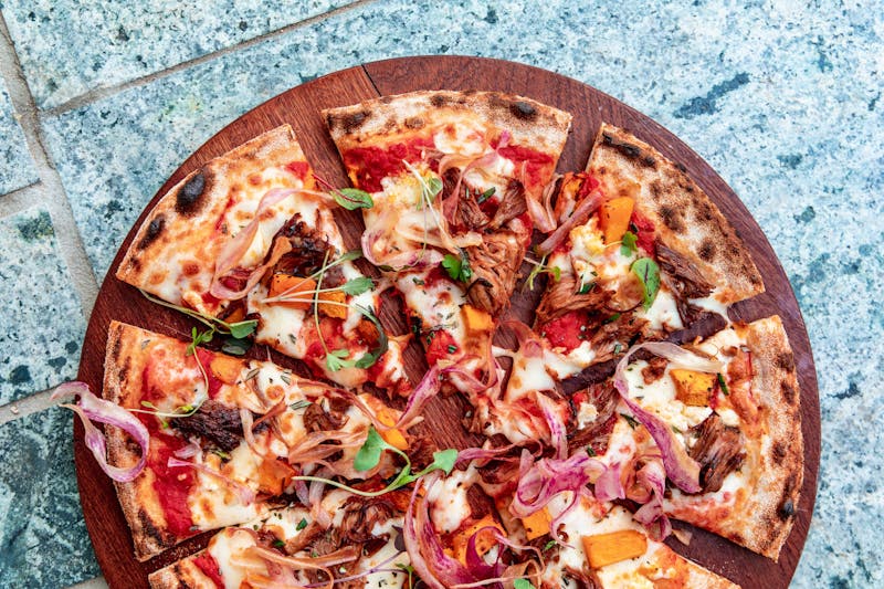 Smokehouse Ranch pizza with pulled pork and pickles